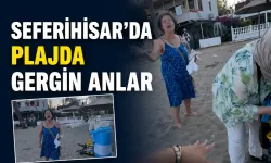 Seferihisar’da plajda gergin anlar kameraya yansıdı: Sandalyeyi yere fırlattı